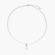 Dainty necklace with lavender crystal beads, freshwater pearls, geometric pendant, and large pearl drop on white background.
