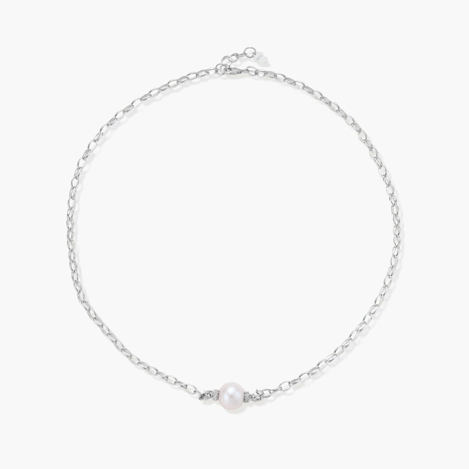 Dainty rhodium-plated silver chain necklace with centered 10mm freshwater pearl and crystal accents on cream background