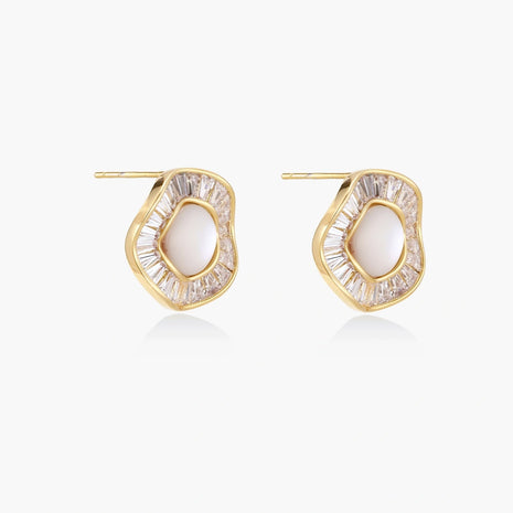 Gold-plated stud earrings with central freshwater pearl surrounded by radiating baguette crystals in sunburst design
