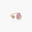 Adjustable gold ring with pink baroque freshwater pearl and crystal-studded star charm on white background