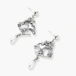 Ornate silver-toned masquerade mask jewelry set featuring rhinestone details and pearl drop earrings on white background.