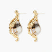 Close-up of metallic dragon-wrapped earrings with marbled resin stones on white background
