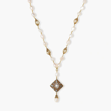 Y-shaped necklace with freshwater pearls, gold filigree stations, and ornate diamond-shaped centerpiece with pearl drop