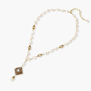Y-shaped necklace with freshwater pearls, gold filigree stations, and ornate diamond-shaped centerpiece with pearl drop