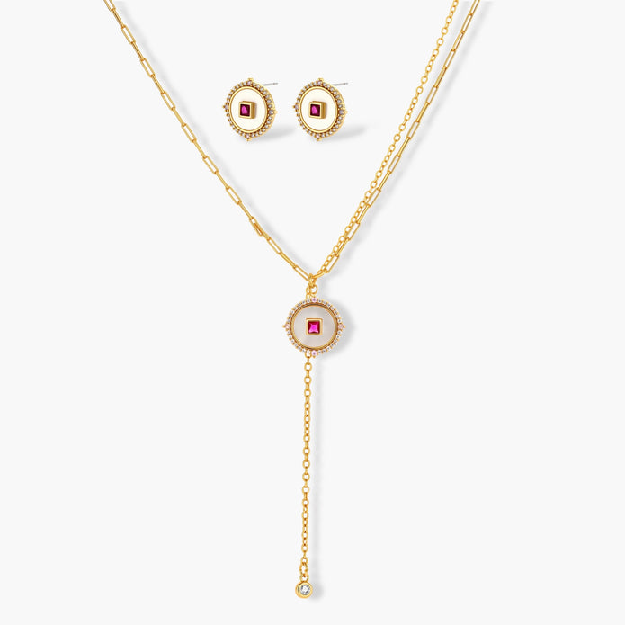 Gold-plated circular medallion necklace set with white enamel base and pink cubic zirconia accent stones