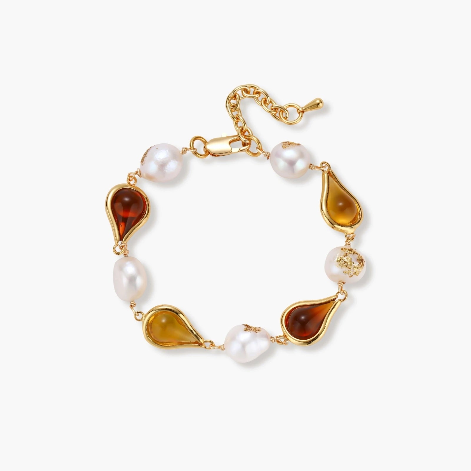 Elegant bracelet with alternating baroque pearls and amber teardrop gemstones set in 18k gold-plated copper on cream background.